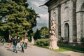 Prague, Czech Republic. Tourists Admire Statues Opposite Renaissance Royal Ball Game Hall In Autumn Day. Royalty Free Stock Photo