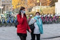 11/16/2020. Prague. Czech Republic. Two woman wearing a mask are crossing the railways at Hradcanska tram stop during quarantine