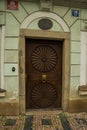 PRAGUE, CZECH REPUBLIC: Unusual miniatures decor on wooden door. Beautiful door