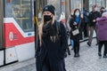 11/16/2020. Prague. Czech Republic. A woman wearing a mask is getting of the tram at Hradcanska tram stop during quarantine