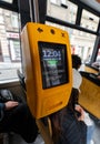 Yellow ticket validator inside Prague tram Royalty Free Stock Photo