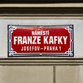 Street sign of Franz Kafka street in Prague, red sign with white writing Royalty Free Stock Photo