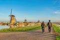 Dutch Windmill landscape at Kinderdijk Netherlands with love couple Royalty Free Stock Photo