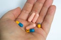 PRAGUE, CZECHIA - DECEMBER 4, 2022: Hand full of pills, atomoxetine and venlafaxine, drugs for ADHD and antidepressants Royalty Free Stock Photo