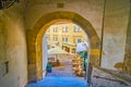 The view through the medieval arch on outdoor restaurant on Radnicke Schody staircases in Hradcany district of Prague, Czechia Royalty Free Stock Photo