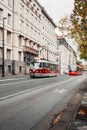 PRAGUE, CZECHIA - October 31, 2023 Vertical photo of old retro red tram in city centre of Prague. Traffic in Prague - transport in