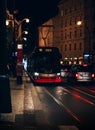 PRAGUE, CZECHIA - October 29, 2023: Vertical photo of red tram at night in Prague.