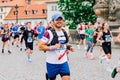 Prague, Czechia - 7th May 2023 - Group athletes runners run marathon in sunlight