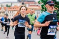 Prague, Czechia - 7th May 2023 - Group athletes runners run marathon in sunlight