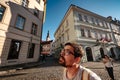 Prague, Czechia - 10.08.2019. young man is surprised and enjoys the beautiful old city