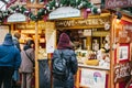 Prague, December 15, 2016: The tourist looks at the goods in the traditional Christmas market. Celebrating Christmas in