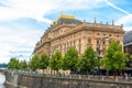 Prague embankment on a summer day. Panorama of the city. Beautiful buildings