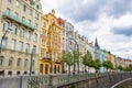 Prague embankment on a summer day. Panorama of the city. Beautiful buildings