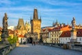 Prague main symbol at dawn: Charles Bridge, Lesser Town Bridge Towers and Prague castel. Czech Republic, Bohemia Royalty Free Stock Photo