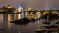 Prague medieval architecture and Charles bridge over Vltava river at night