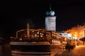 Prague at night, boat on the dock of the Vltava river, reflection of lights