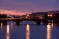 Prague at night, view of the Vlatava river, reflection of night city lights, cityscape Royalty Free Stock Photo