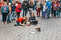 Prague, October 28, 2017: Creative young girls - artists paint pictures on the street next to the Prague Castle