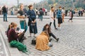 Prague, October 28, 2017: Creative young girls - artists paint pictures on the street next to the Prague Castle