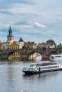 Prague old town,  iconic Charles bridge over Vltava river, and cruise ship in Prague, Czech Republic Royalty Free Stock Photo