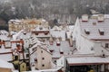 Prague old town red tiled roof under snow in winter day, European medieval city view, ancient architecture, touristic view, Lesser Royalty Free Stock Photo
