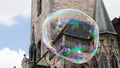 Prague old town square in a huge soap bubble