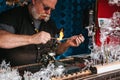 Prague, September 25, 2017: Craftsman makes a product made of glass.