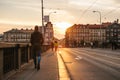 Prague, September 23, 2017: People walk or walk on the bridge at sunset. Traditional Czech architecture