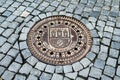 Prague street detail - storm drain and stone sets Royalty Free Stock Photo