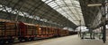 Praha, Czech republic - October 28, 2018 - vestibul of train station named Praha hlavni nadrazi with nice woman and freight train