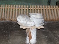 A large boot cut from salt on a wooden stand in salt mines in Slanic - Salina Slanic Prahova - in the town of Prahova in Romania.