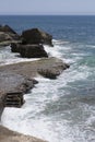 Praia da Azarujinha, beach in Estoril, portugal. Black stone coast with steps to ocean