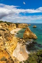 Praia da Marinha, beautiful beach Marinha in Algarve, Portugal. Navy Beach (Praia da Marinha) with flying seagulls Royalty Free Stock Photo