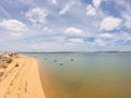 Praia De Faro, Algarve, Portugal. Aerial view on coast of ocean and beach. Boats on water, drone view Royalty Free Stock Photo