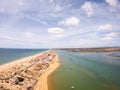 Praia De Faro, Algarve, Portugal. Aerial view on coast of ocean and beach. Boats on water, drone view Royalty Free Stock Photo