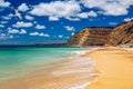 Praia de Porto de Mos with seagulls flying over the beach, Lagos, Portugal. Praia do Porto de Mos, long beach in Lagos, Algarve Royalty Free Stock Photo