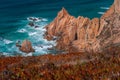 Praia do Ursa beach with beautiful orange colored cliffs on Atlantic ocean coast near popular touristic Cabo da Roca Royalty Free Stock Photo