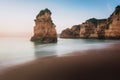 Praia Dona Ana Beach and Rock formations at sunrise - Long Exposure shot - Lagos, Algarve, Portugal Royalty Free Stock Photo