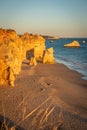 Praia dos Tres Castelos in south Portugal, Portimao, Algarve region. Sunset landscape with Atlantic Ocean, shore and rocks in Tres Royalty Free Stock Photo