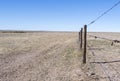 Prairie in Eastern Colorado with a Fence Line and Barbed Wire. Royalty Free Stock Photo