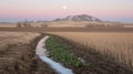 Prairie irrigation ditch, moonrise, winter field Royalty Free Stock Photo