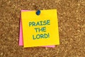 praise the lord postit on corkboard