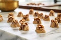 pralines cooling on a marble countertop