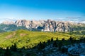 Pralongia high plateau with rocky peaks on the background in the Dolomites during beautiful summer morning Royalty Free Stock Photo