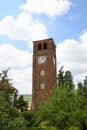 Ancient tower with iron mechanical clock