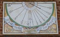 Beautiful sundial painted on the wall of the city castle Royalty Free Stock Photo