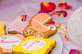 Pram shaped gingerbread cookies on white plate. Candy bar with sweets for girl birthday party. Royalty Free Stock Photo