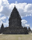 Prambanan Temple in the afternoon with a cloudy blue sky background