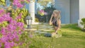 Pranayama yoga breath exercise by a young woman in the backyard of her house. Royalty Free Stock Photo