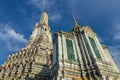 Prang and secondary building, Wat Arun, Bangkok. Blue Sky and clouds. Royalty Free Stock Photo